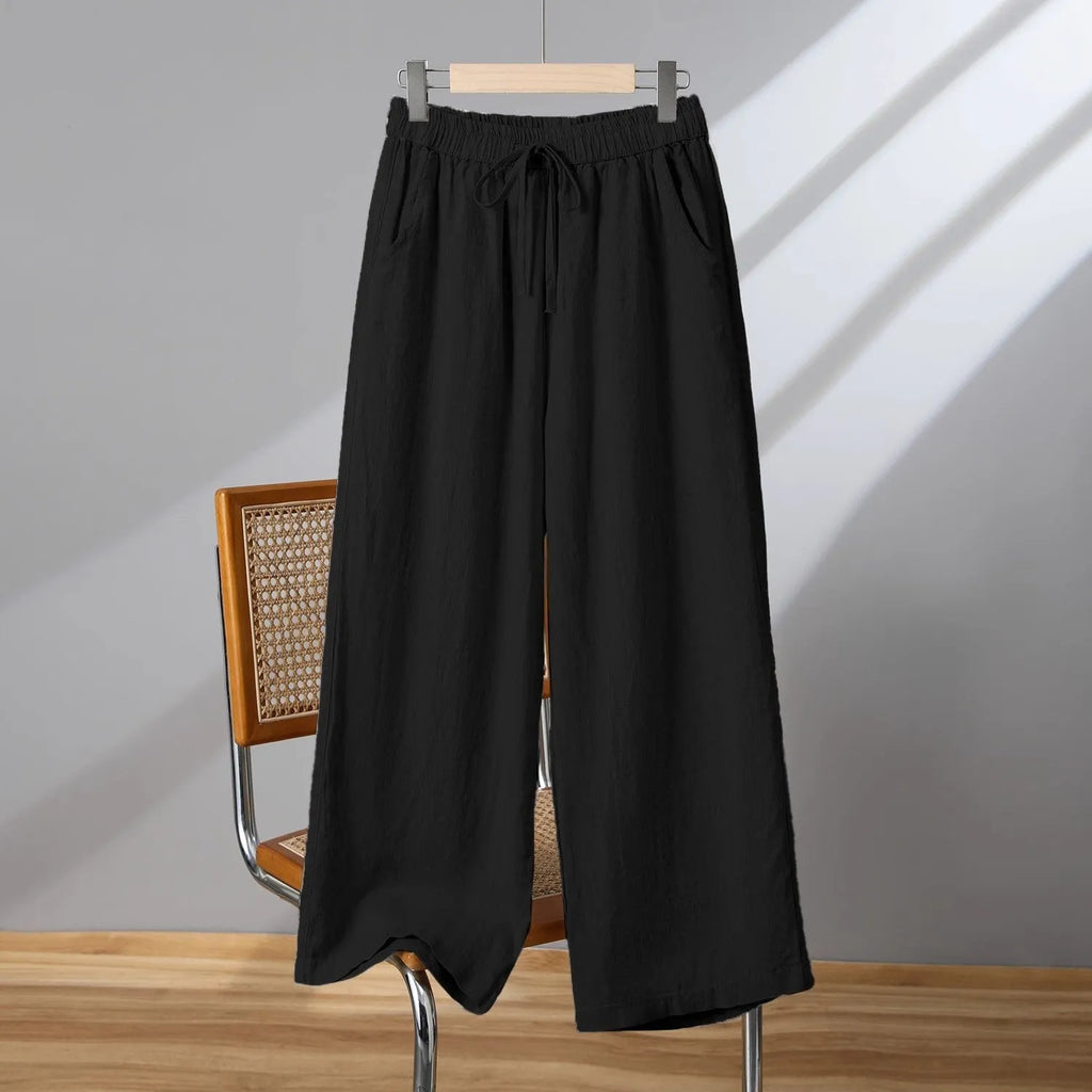 Women's straight-leg casual trousers with an elastic drawstring waist, shown in apricot colour.