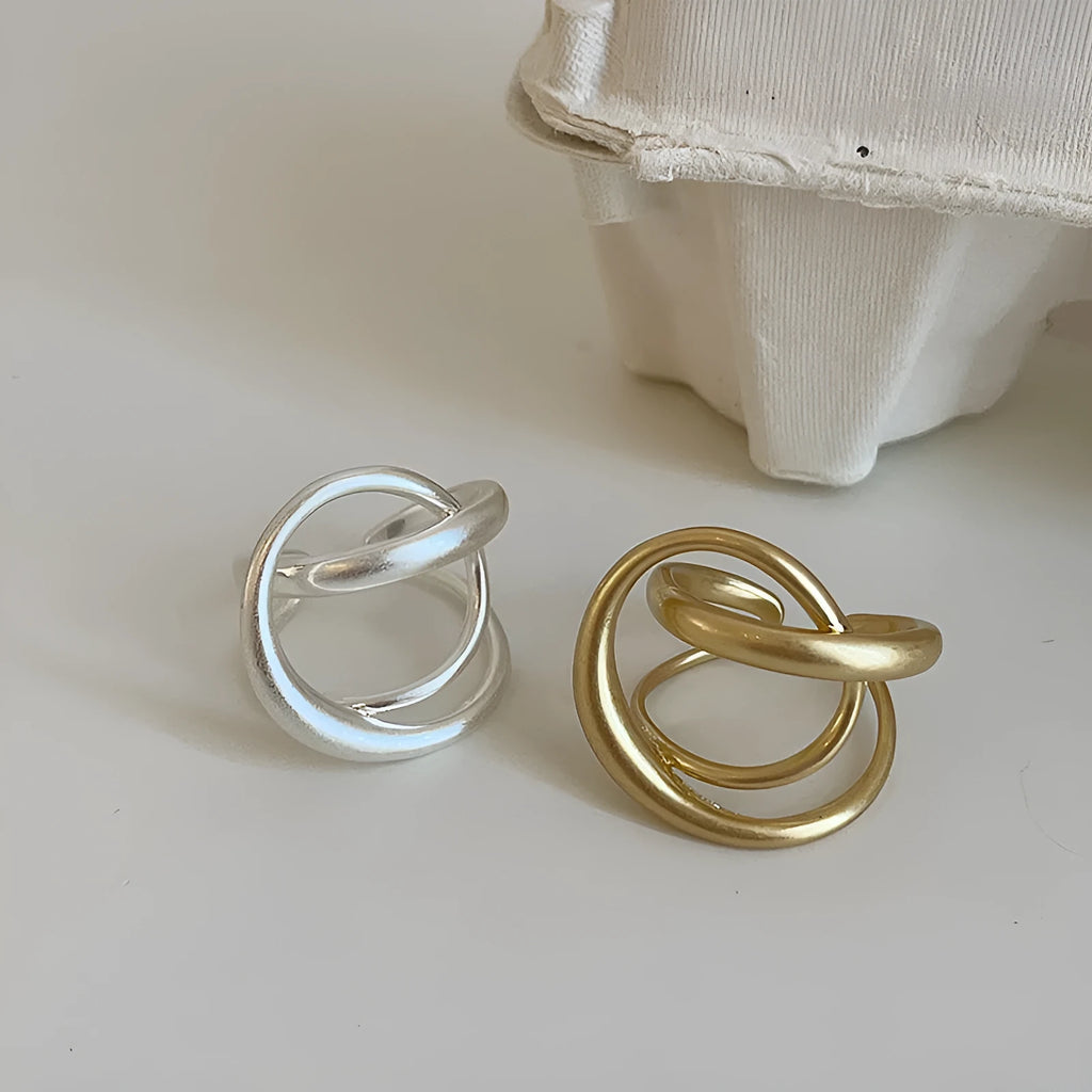 Three-dimensional interlaced geometric open ring in matte metal with gold or silver plating