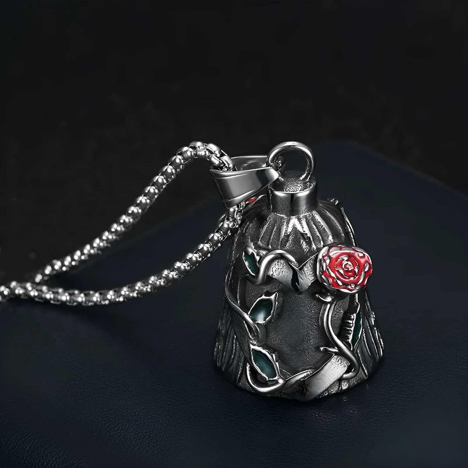 Titanium steel motorcycle lucky bell with vintage polished finish showing double-sided epoxy rose design