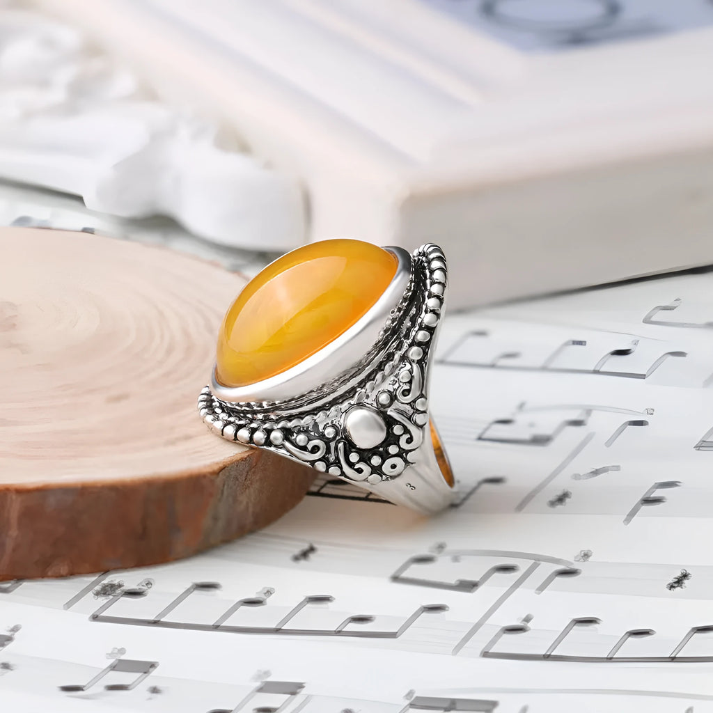 Retro geometric alloy ring with fluorescent beeswax and antique silver plating, shown in size 10.