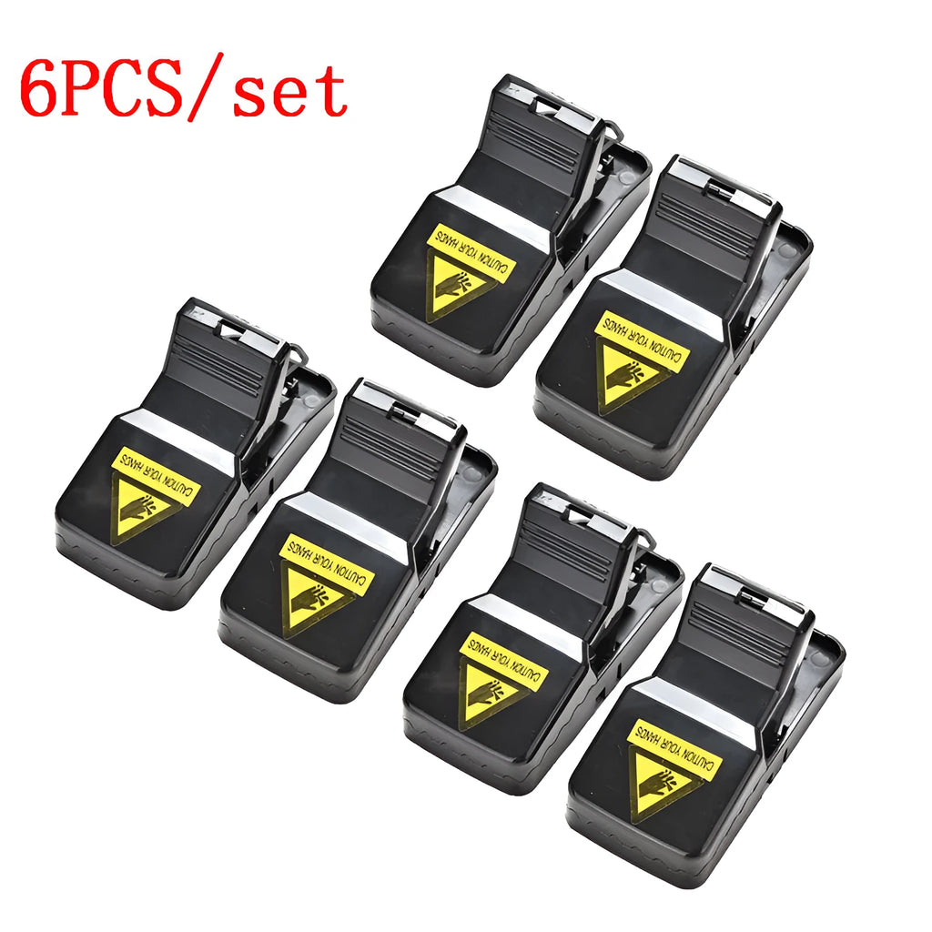 Six black plastic snapping mousetraps showing 11cm length and biting mechanism