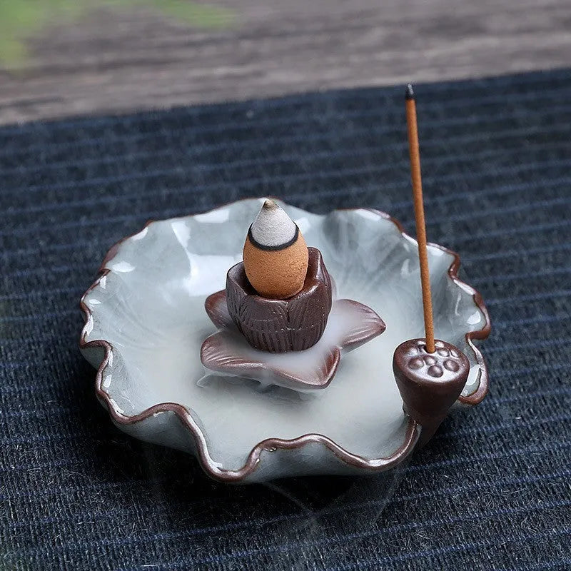Purple clay ceramic reverse flow incense burner with lotus and plum blossom motifs