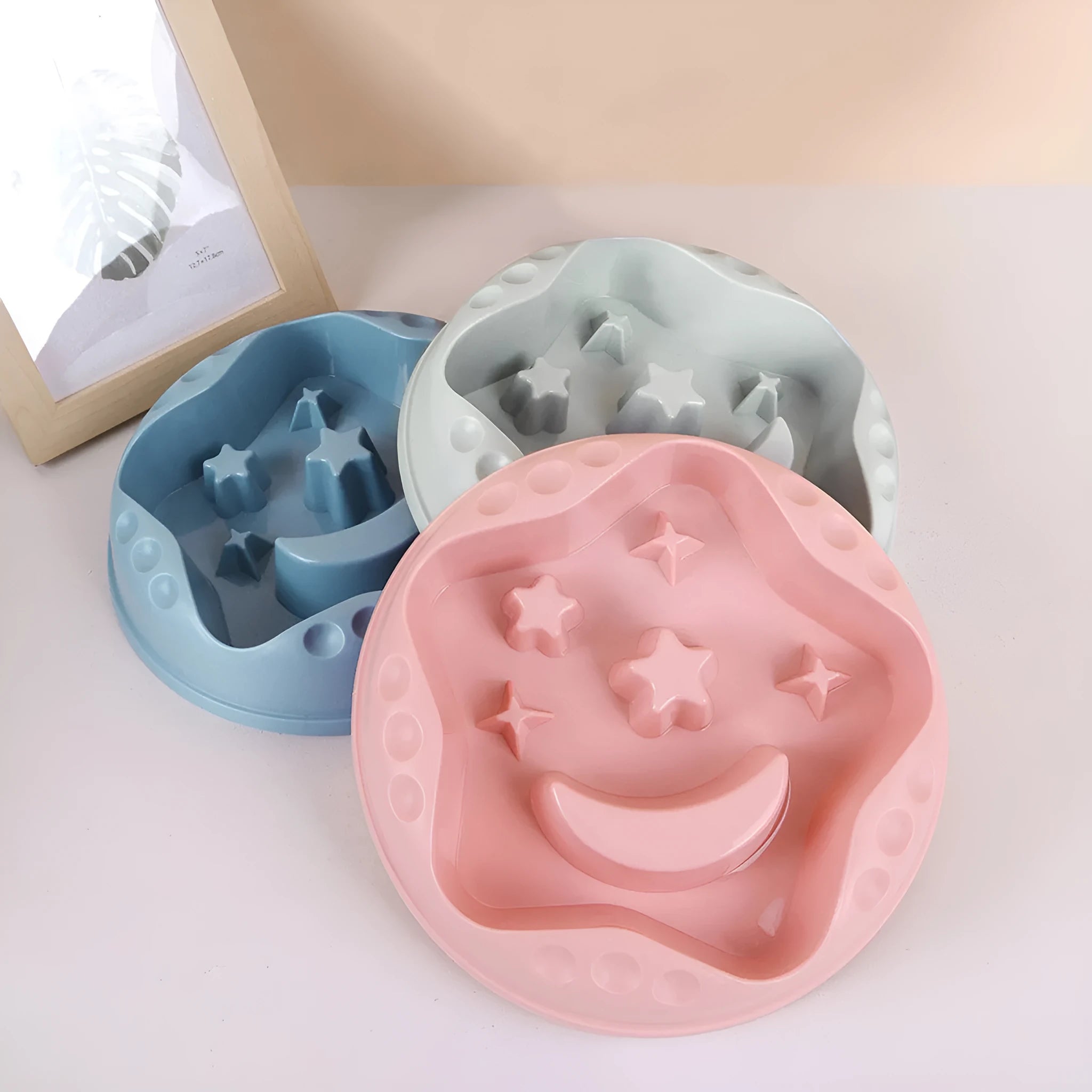 Moon star wings design slow feeder dog bowl for large dogs in blue, shown on a floor