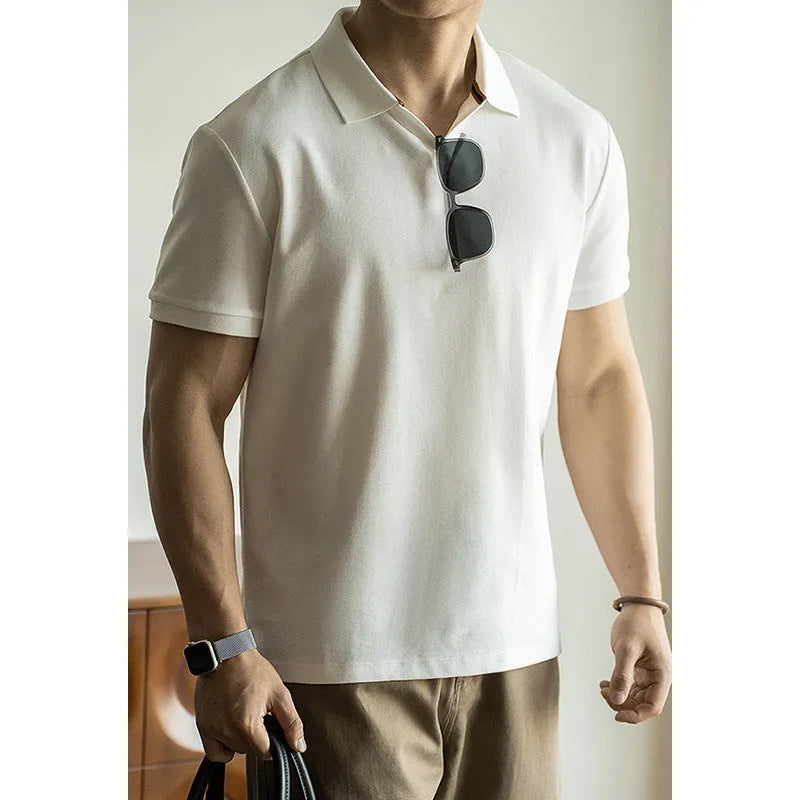 Man's short-sleeve blue polo shirt on a hanger, showing the classic collar and button placket.