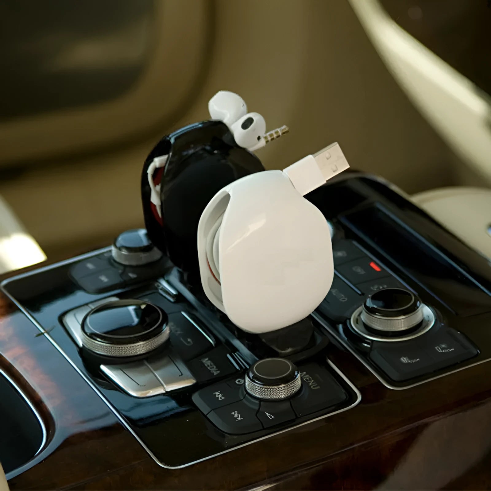 Automatic earphone cable winder retractor in PC ABS plastic, showing compact size and multiple colour options.