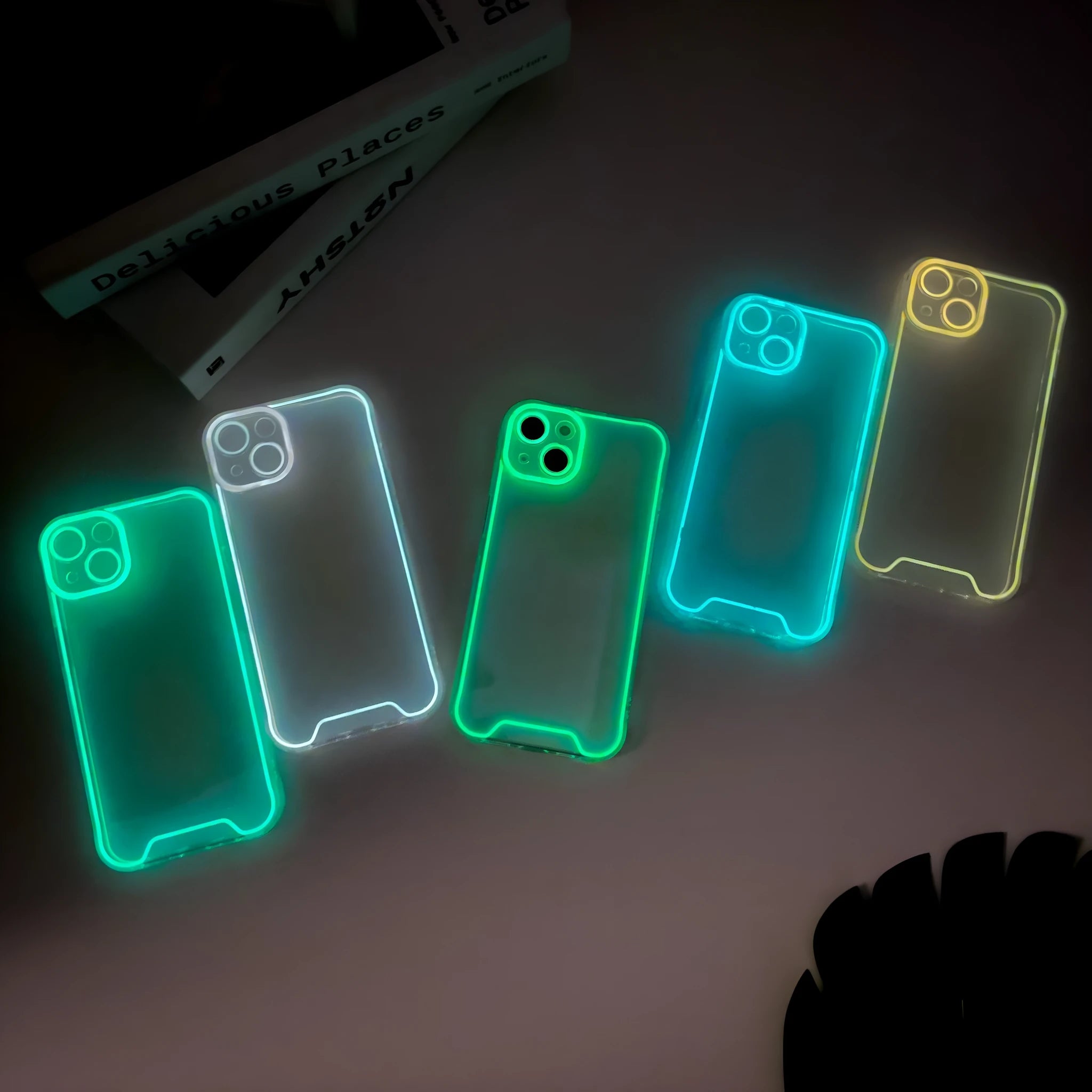 Glow in the dark green soft TPU phone case for Apple iPhone on a dark background.