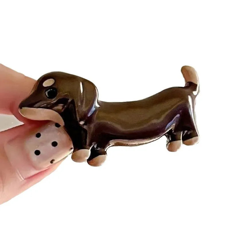 Close-up of a cute dachshund dog hair barrette with an electroplated finish.