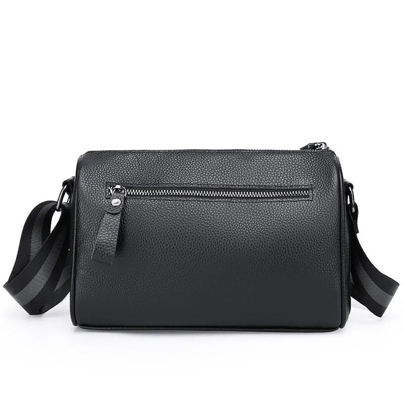 Black genuine leather one-shoulder crossbody bag showing its large size and polyester lining.