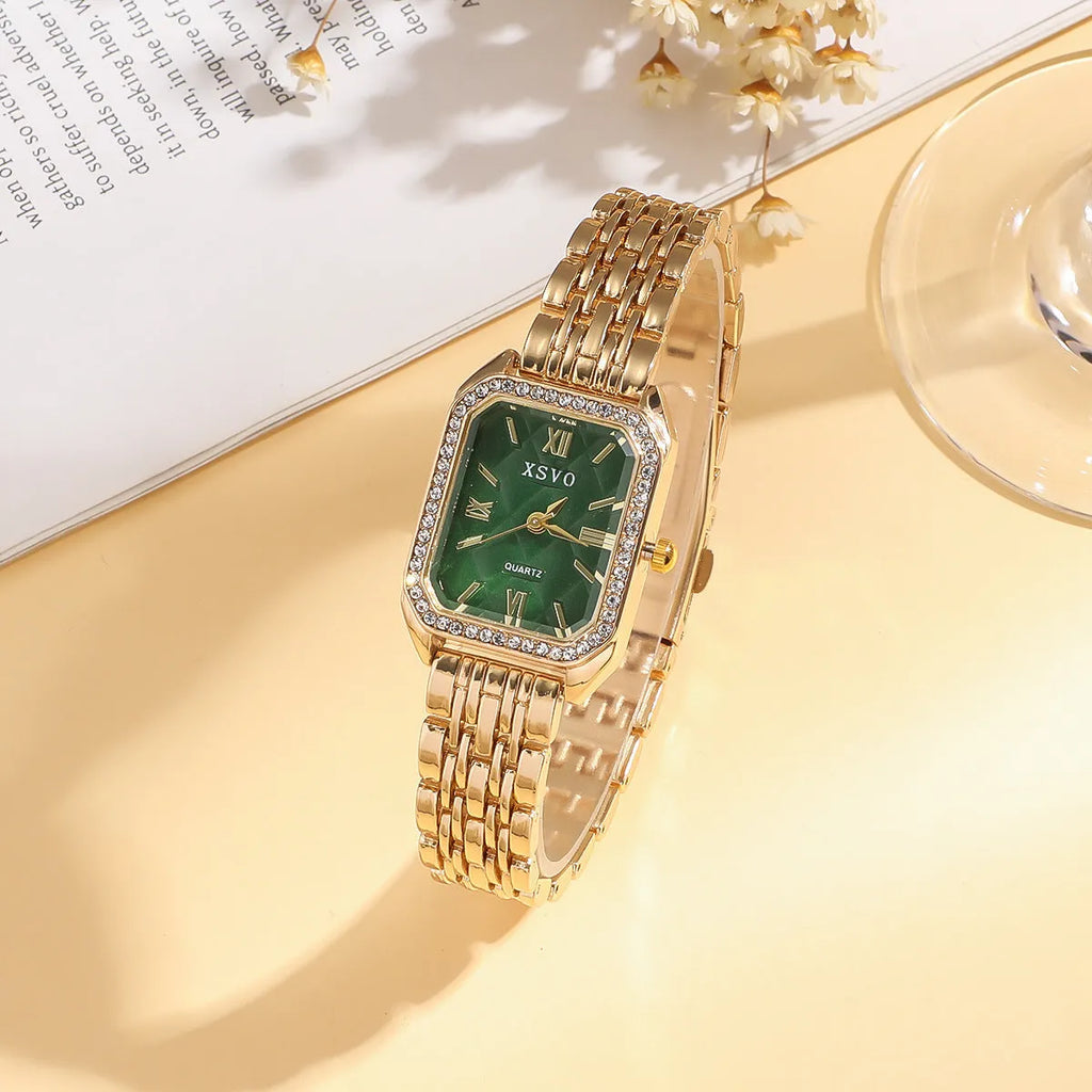 Gold green square women's watch with four matching bracelets on display