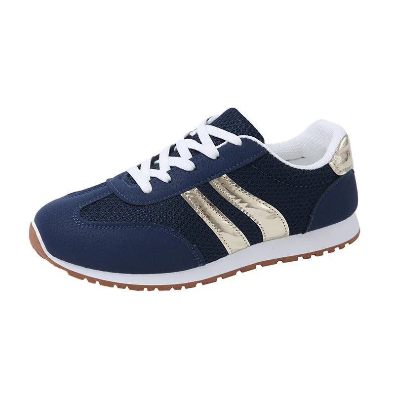 Blue women's casual tennis shoes with cross shoulder straps and white rubber sole