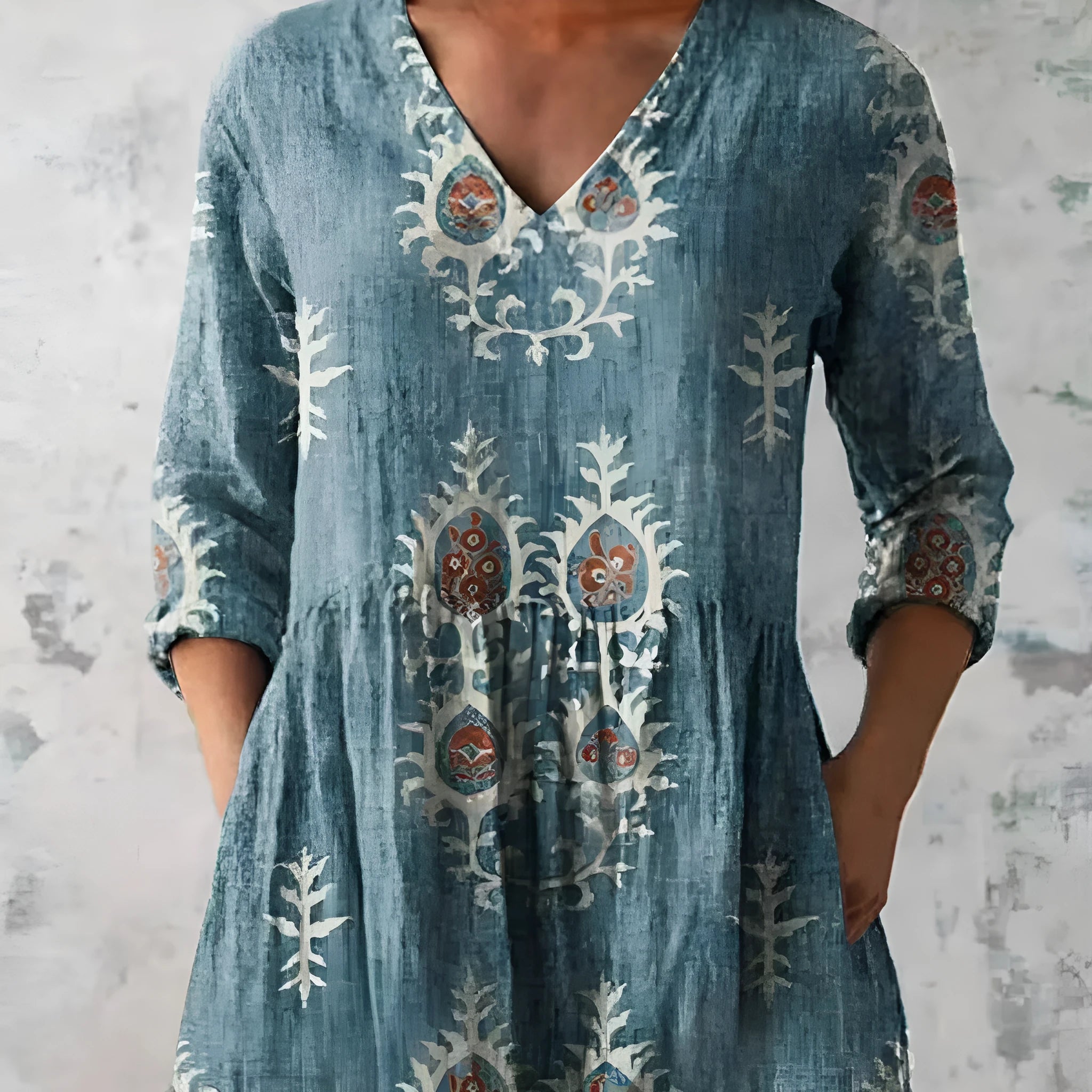 Women's loose-fit dress with a blue and white wave print, wide waist, and 3/4 length sleeves.
