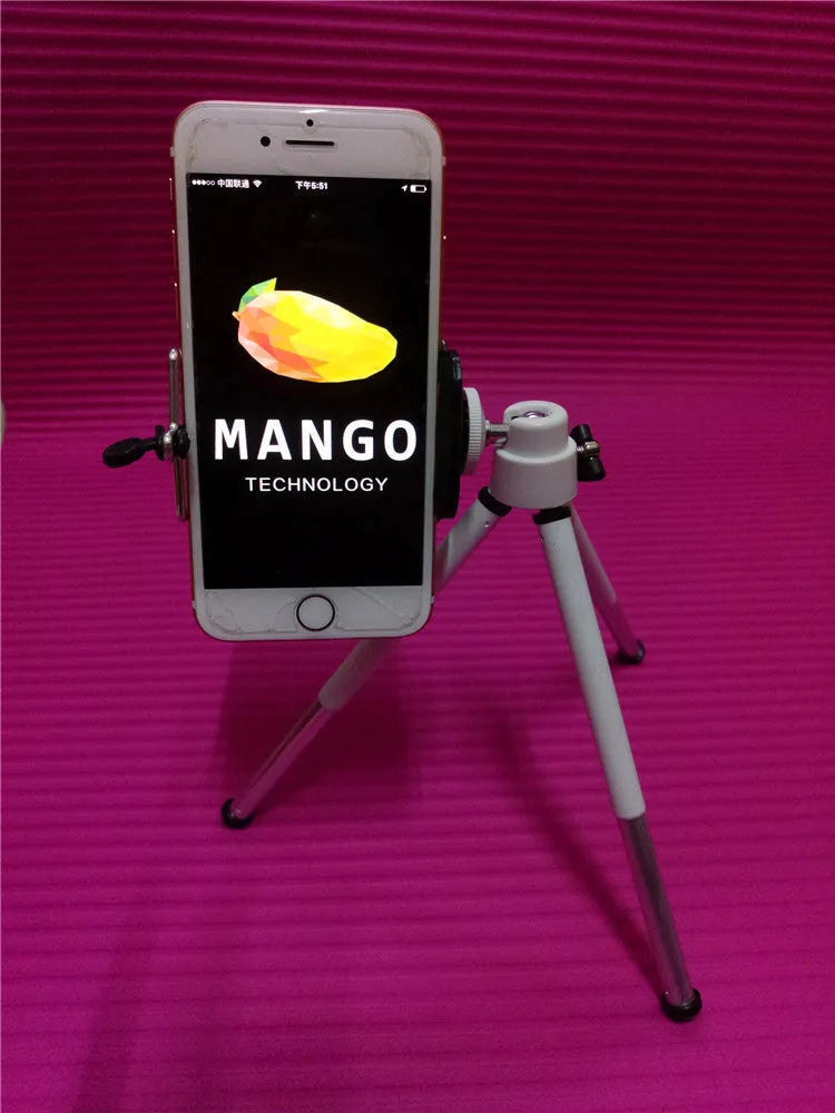 Black and silver desktop phone holder with two-section adjustable bracket on a desk