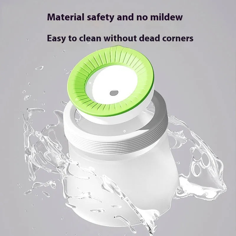 Green raised pet suspension bowl for dogs and cats on a white plate.