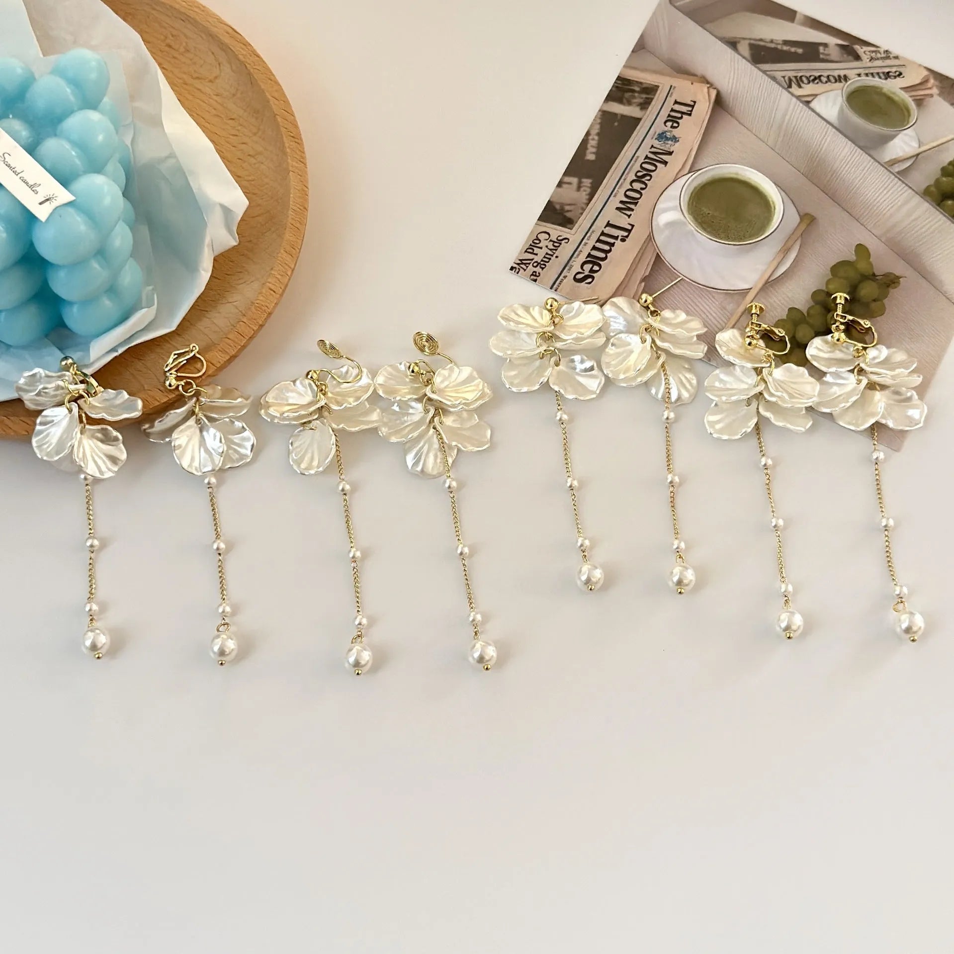 Women's acrylic shell pearl tassel earrings showing 8.8cm length with multiple clip style options