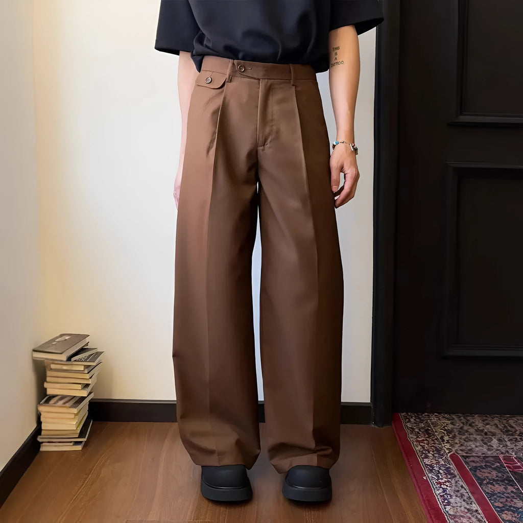 Brown men's straight-leg loose-fit suit trousers laid flat, showing wide-leg drape style.