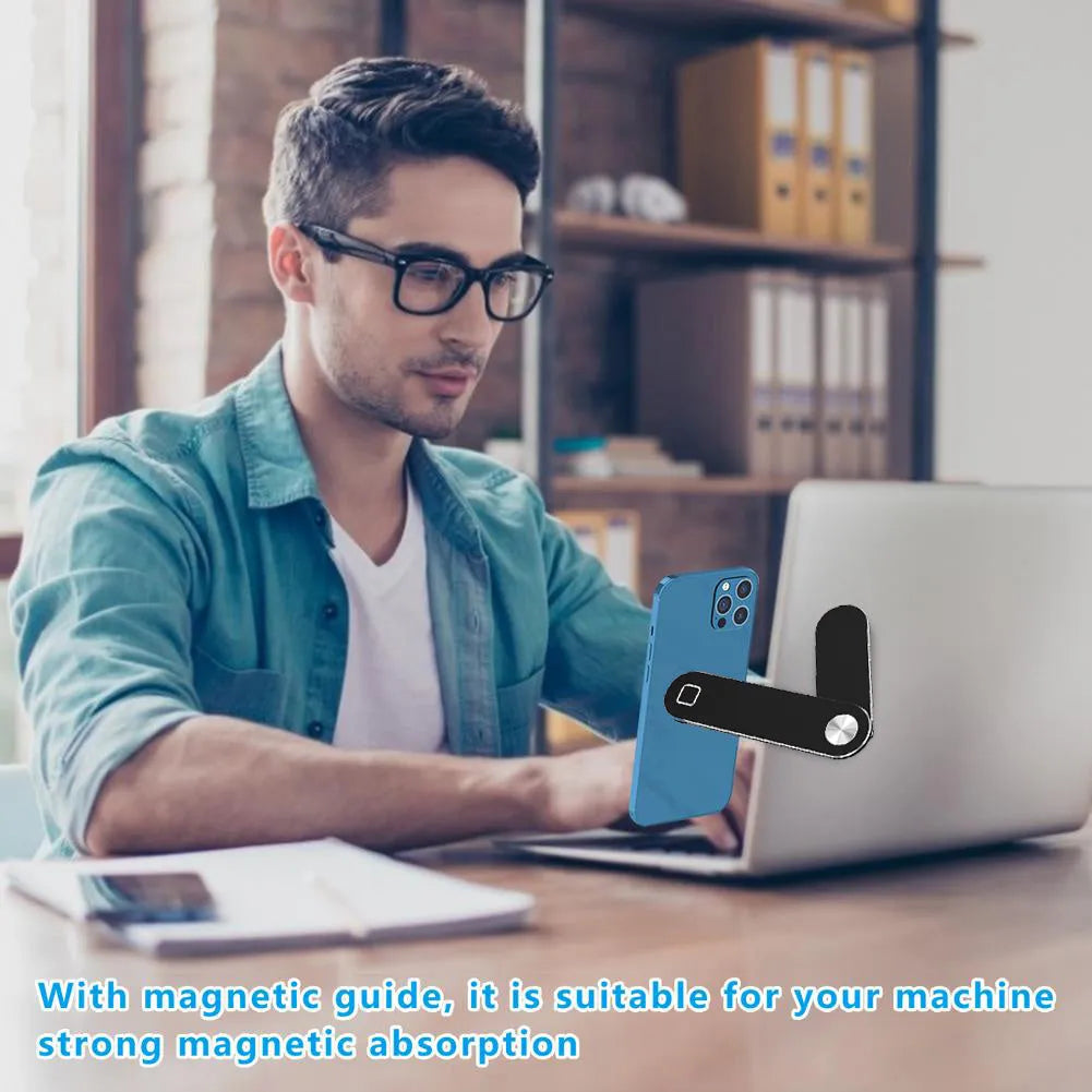 Black aluminium laptop phone holder mounted on computer monitor with smartphone attached