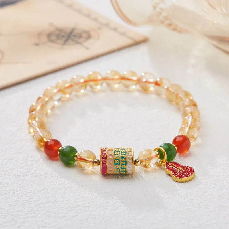 Hand-woven citrine crystal bracelet with five-sutra geometric design in fresh styling