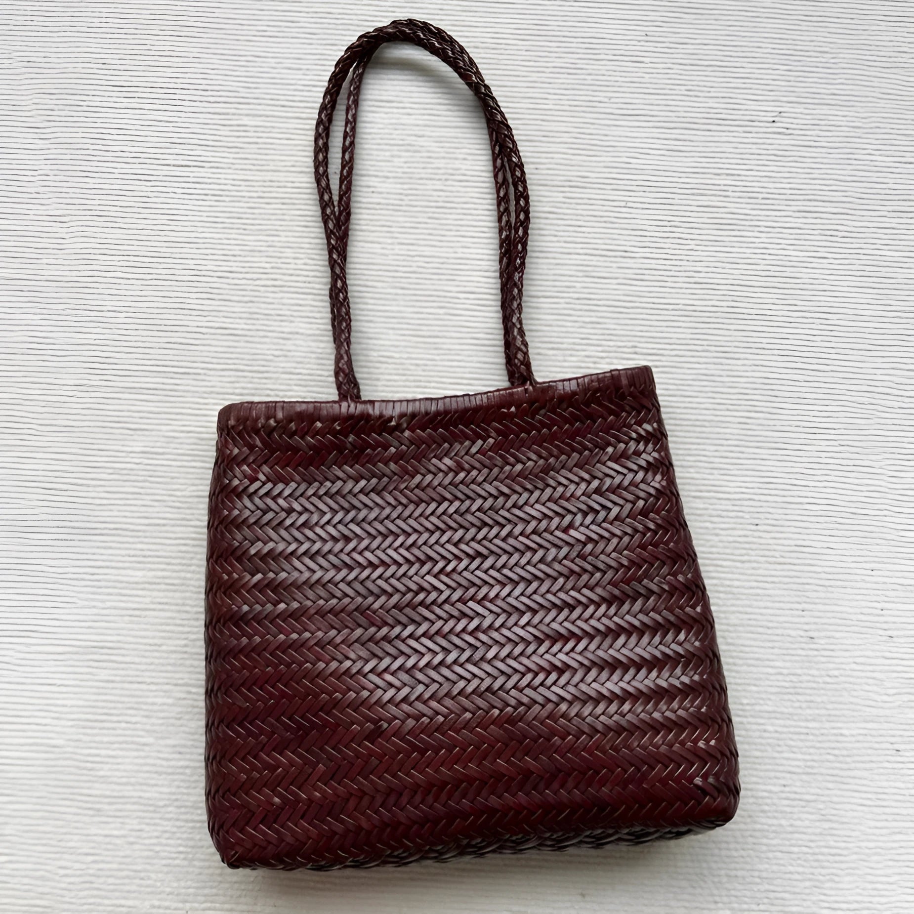 Brown handmade cowhide leather woven shoulder bag with three-dimensional pocket