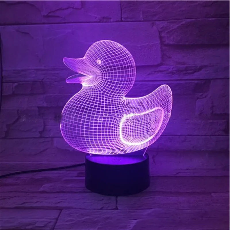 Little yellow duck 3D LED night light showing colour change modes on a desktop