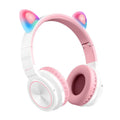 Pink and white wireless Bluetooth over-ear headset with a braided cable on a grey background.