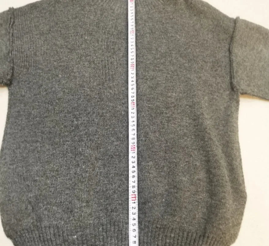 Women's dark grey acrylic sweater suit with side slits and matching trousers