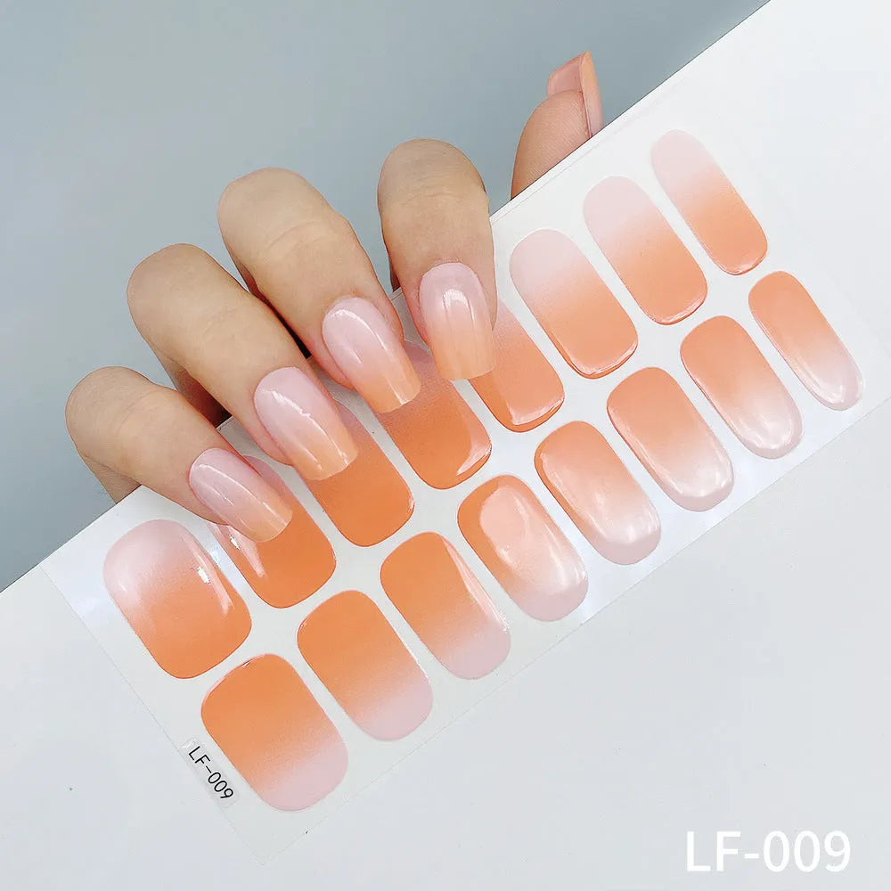 Full coverage nail art stickers sheet with 16 designs including cross, rose, tulip, and cartoon patterns.
