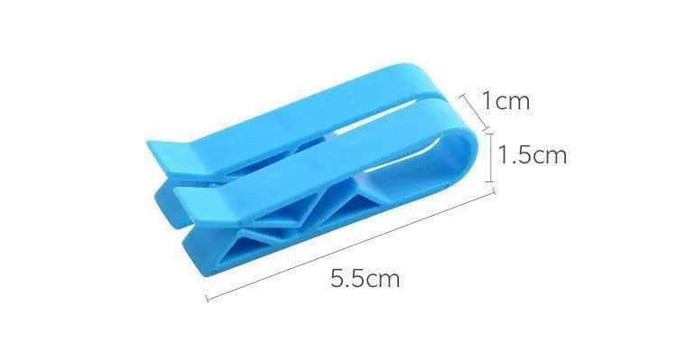 Non-slip plastic fixing clip for holding rubbish bags onto the side of a bin.