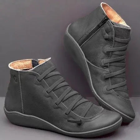 Women's casual flat ankle boots in various colours with a round toe and rubber sole.