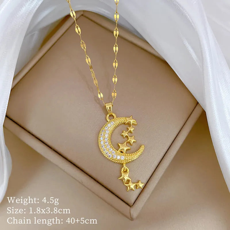 Geometric moon necklace with tassel detail in stainless steel and copper materials