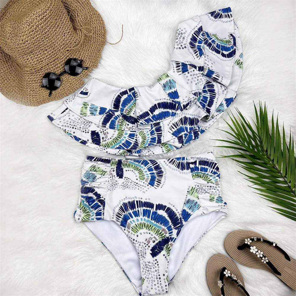 White women's one-shoulder bikini with lotus leaf detail and high-leg split design