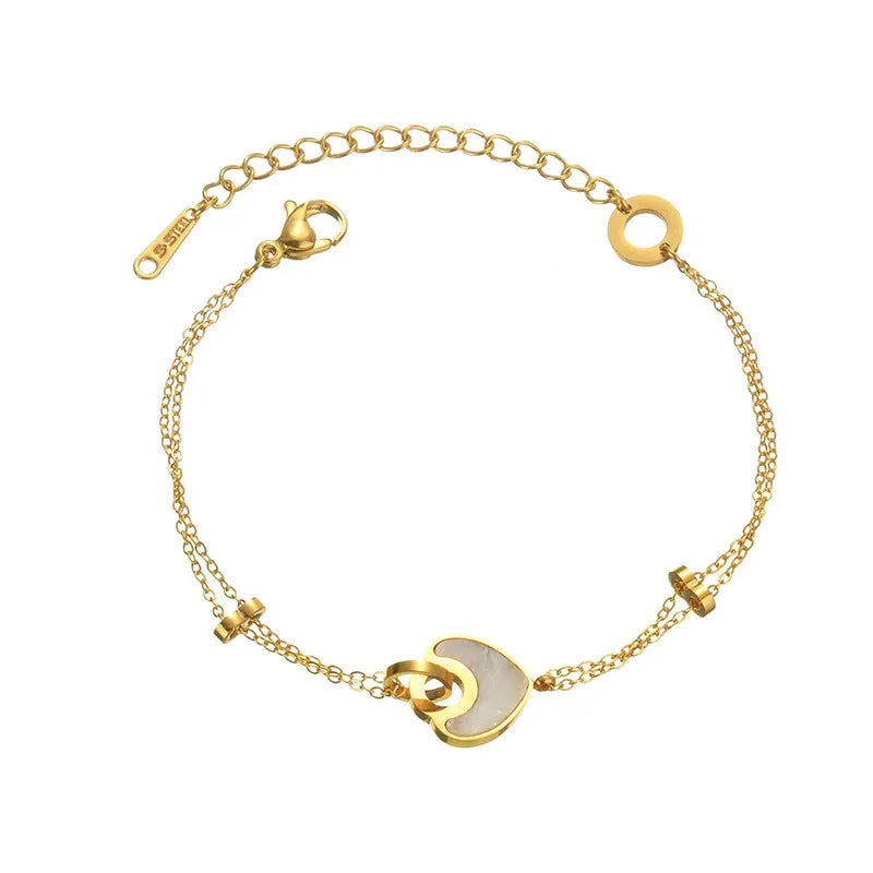 Women's stainless steel bracelet with a double-layered red heart resin charm.