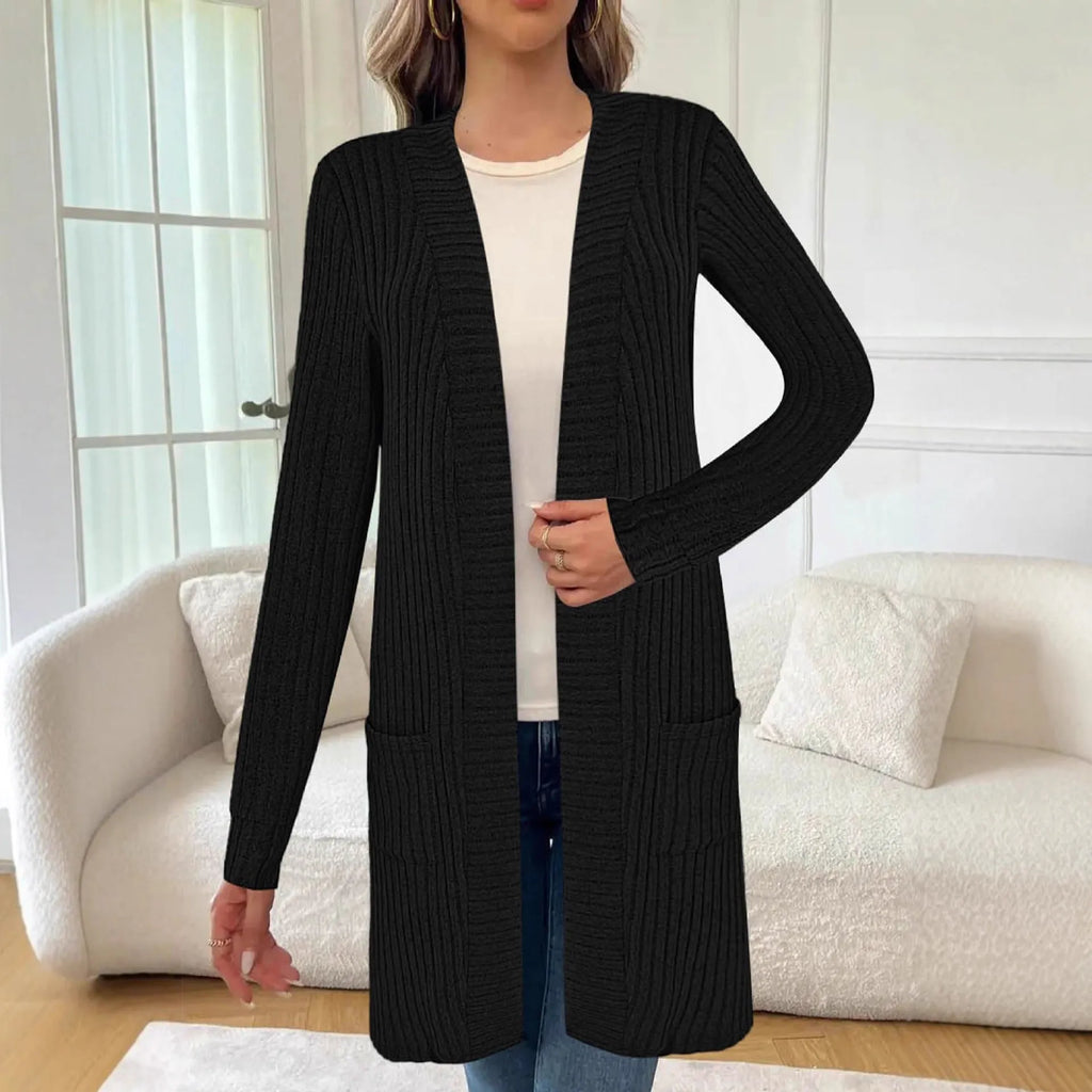 Long sleeve loose fit knitted cardigan jacket with pockets in polyester fabric.