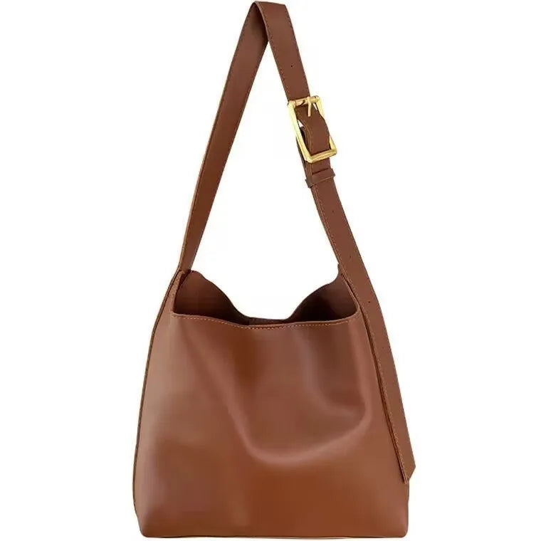 Women's soft PU leather shoulder bag with decorative swing threads in black or brown colour options