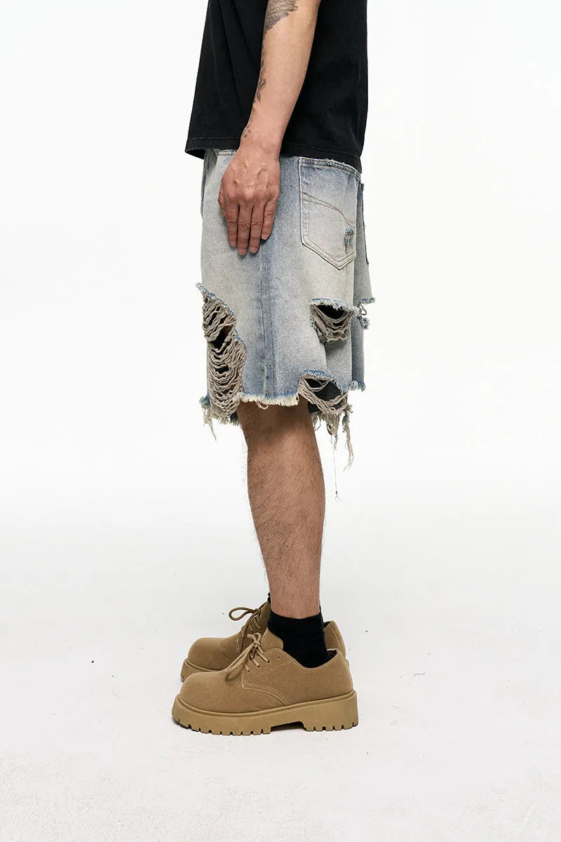Light blue retro washed denim shorts with wide leg baggy cut and fifth pants length