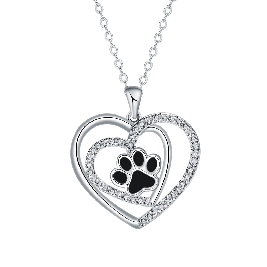 Women's dog paw footprint necklace with heart design on copper pendant and cross chain