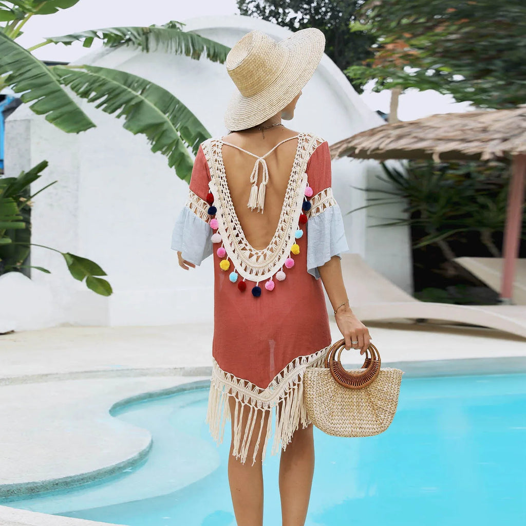 Orange floral pattern beach overskirt with hand crochet stitching and tassel details.