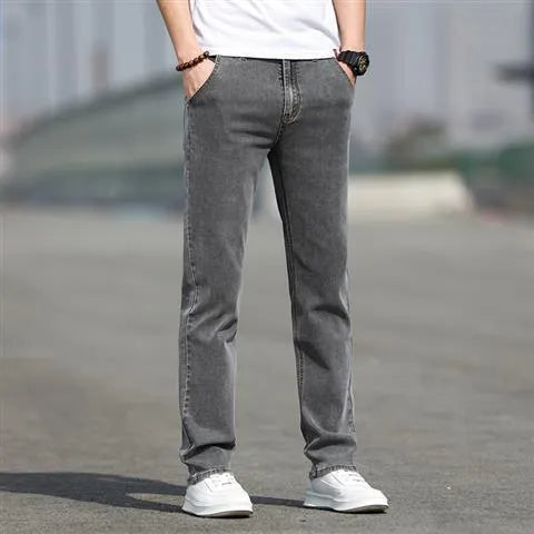 Men's smoky gray straight leg jeans with low waist and zipper fly closure
