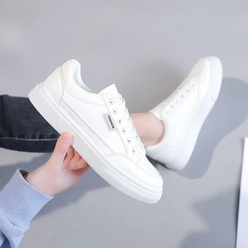Women's low top Korean style sneakers in white or brown artificial PU leather with plastic sole.