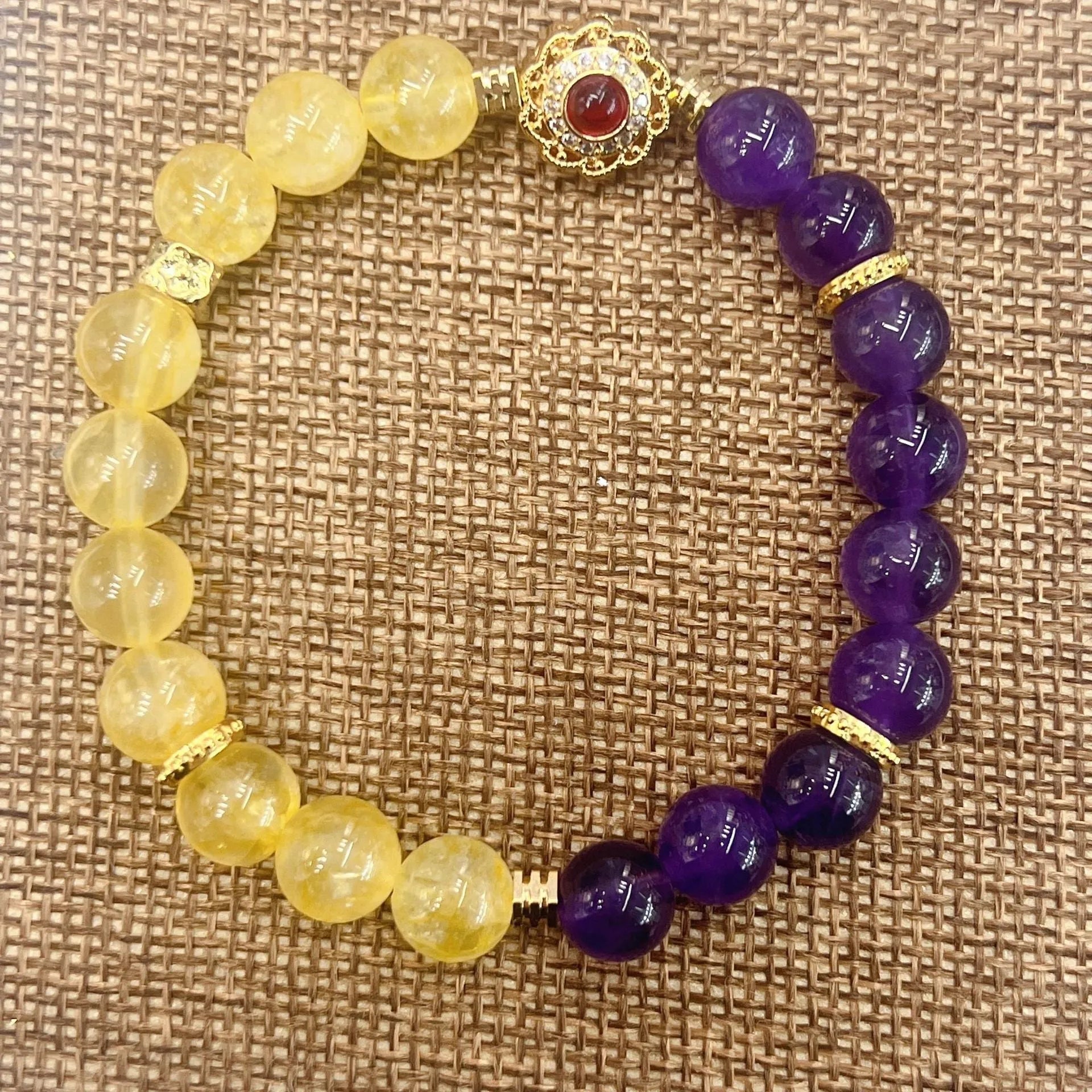 Handmade women's amethyst crystal bracelet with yellow and purple beads