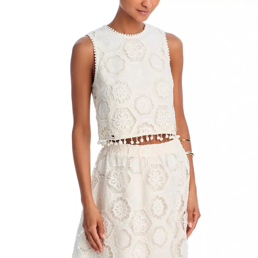 White women's retro style suit set with sleeveless top and embroidered long skirt on hanger