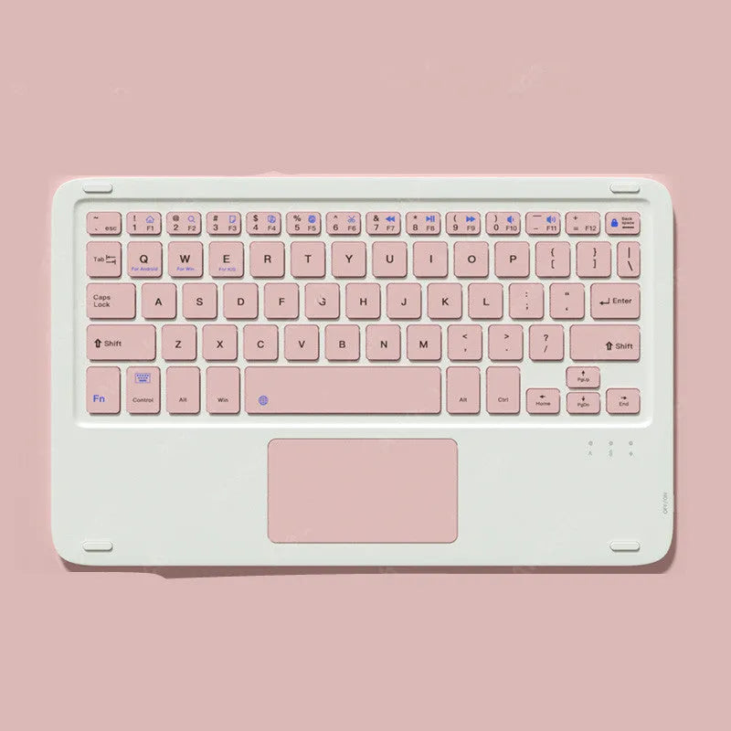 Pink Bluetooth wireless touch keyboard and rechargeable mouse combo on a desk next to a tablet