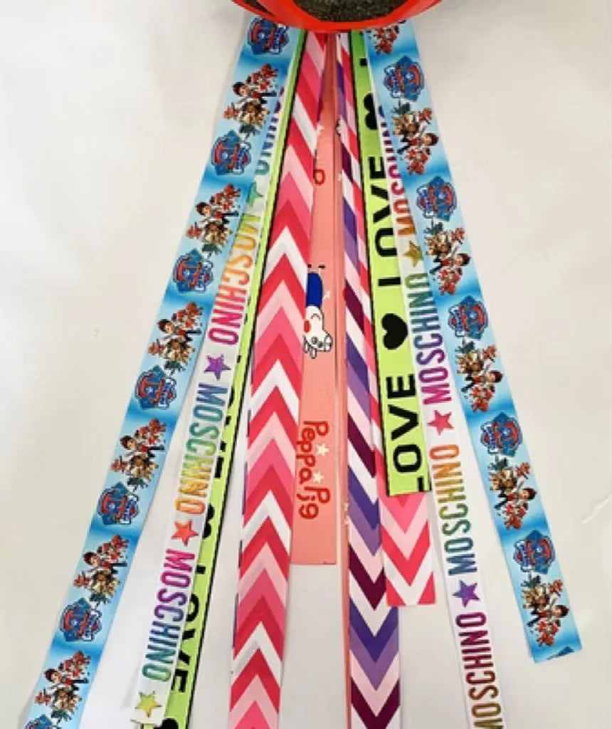 Decorative ribbon streamer for a child's ski or skating helmet in various colour options.
