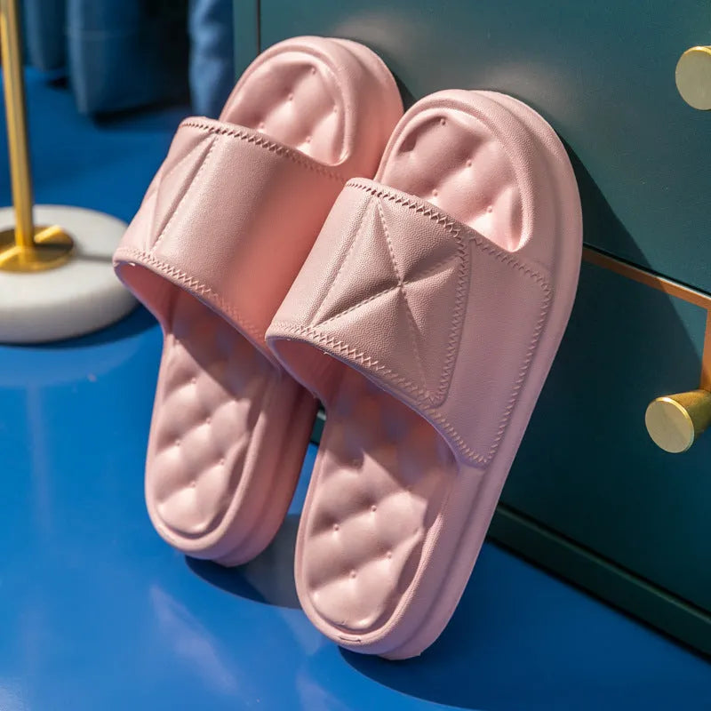 A pair of thick-soled EVA bathroom slippers in a chosen colour, showing the non-slip sole pattern.