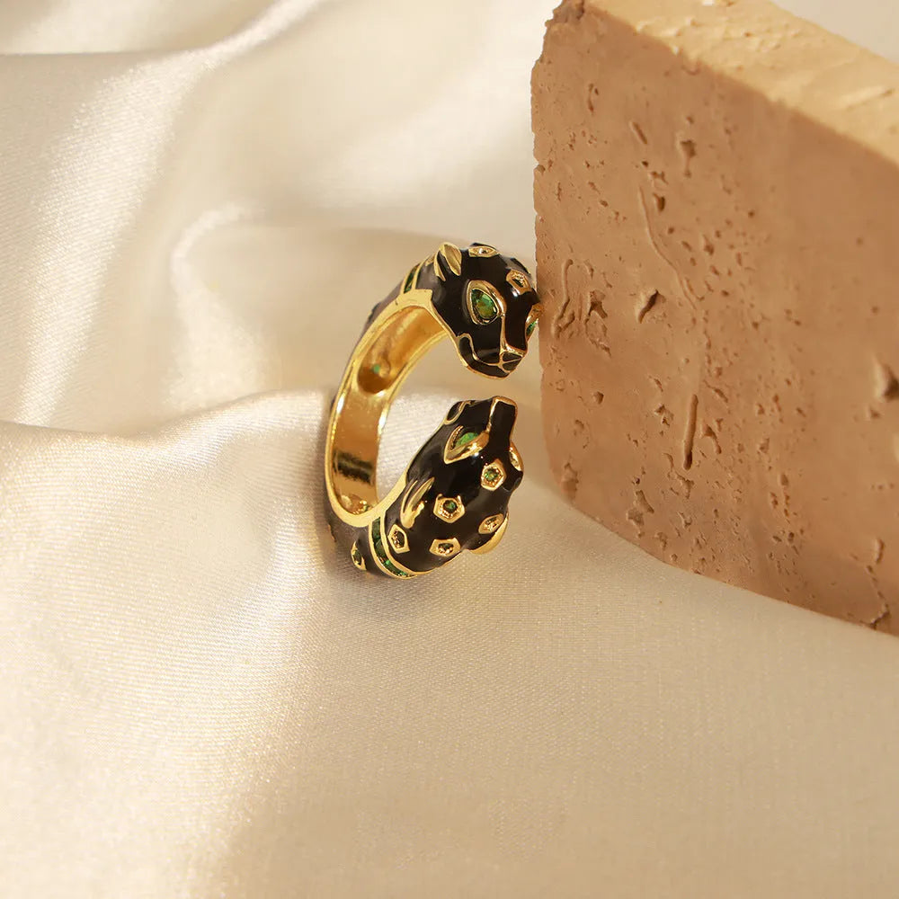 Women's black cheetah print copper ring with geometric open design in size 7