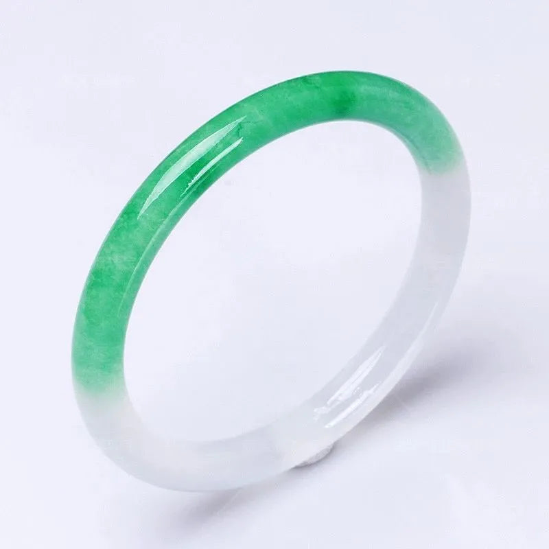 Jade bracelet with floating flower design and auspicious cloud patterns in green colour