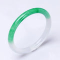 Jade bracelet with floating flower design and auspicious cloud patterns in green colour