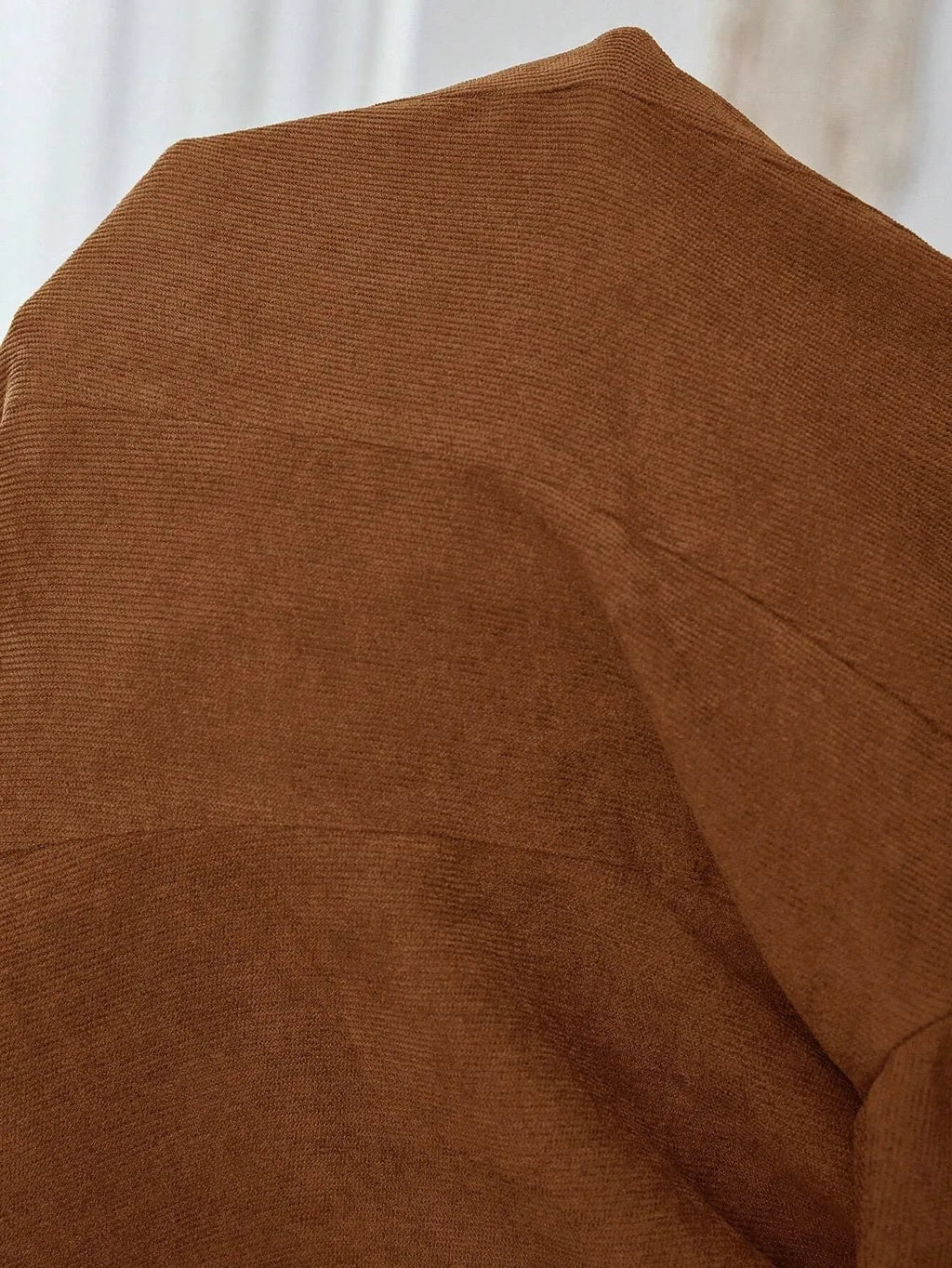 Brown men's lapel long sleeve single-breasted leisure suit coat hanging