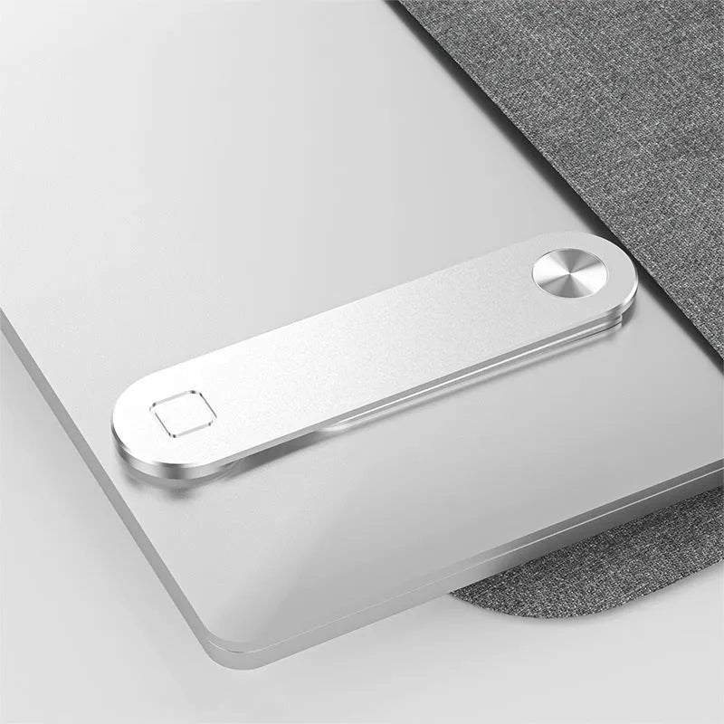 Black aluminium laptop phone holder mounted on computer monitor with smartphone attached