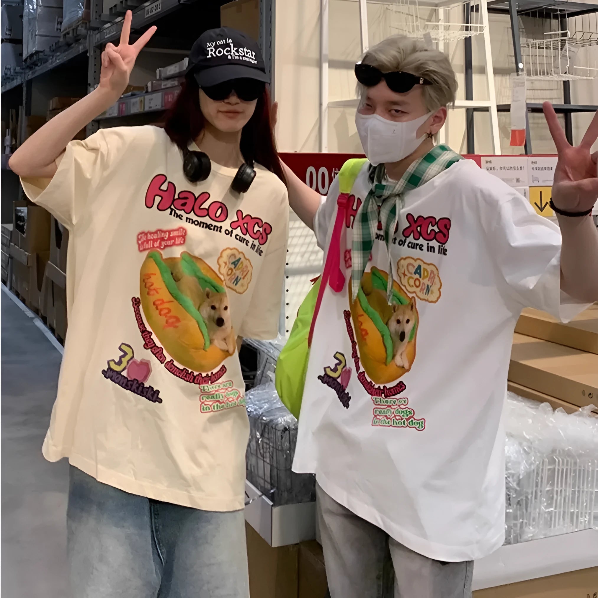 A white loose-fit cotton T-shirt with a large cartoon print of a hamburger dog.