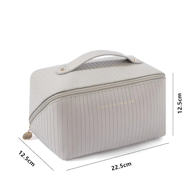 Vertical cubic pillow makeup bag in PU material with 22.5 cm height for travel storage